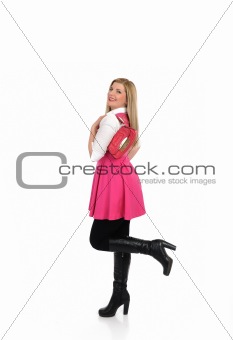 pretty shopping woman in pink dress standing. studio shot