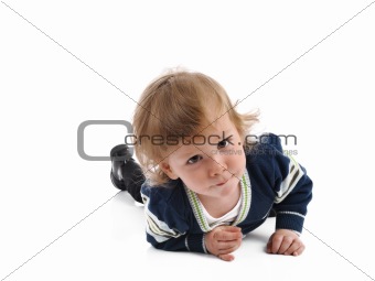 Cute little child smiling on the floor . isolated on white