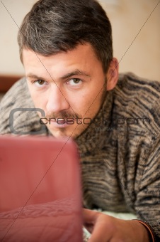 handsome man with laptop computer indoors