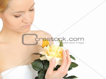Beautiful woman holding yellow rose plant