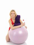 Pretty fitness woman doing exercise with pilates ball. isolated 
