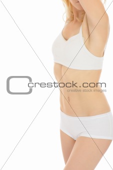Part of beautiful fit slim woman body in white underwear.