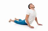 young man practicing yoga postures combination cobra. isolated