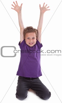 happy young boy with hands raised