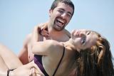 happy young couple have romantic time on beach
