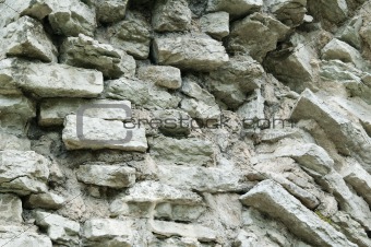 Fragment of a wall from a calcareous stone, a background