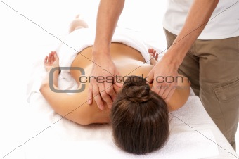 Unrecognizable woman receiving massage relax treatment close-up from male hands