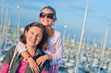 Portrait of a girl with her mother near yachts