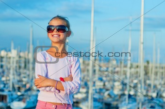 Portrait of a girl in the background of yachts