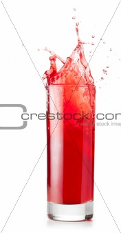 red liquid is spalsing in glass