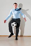 businessman is playing football