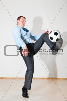 businessman is playing football