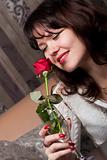 Young gorgeous girl with a red rose