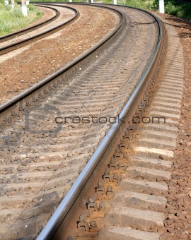 Two railroad ways on concrete cross ties over embankment