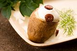 Baked potato with sour cream and fresh dill