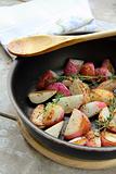 fried radish with thyme in a pan