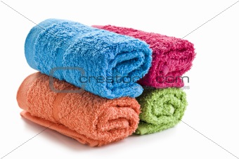 Fresh rolled up towels on a white background