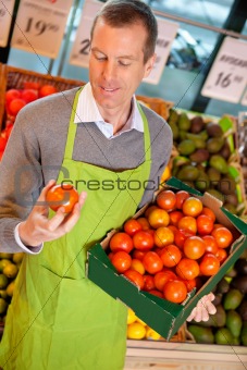 Grocery Store Clerk with Tomatoes