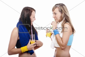 young woman in sports outfit drinking juice, talking - islotad on white