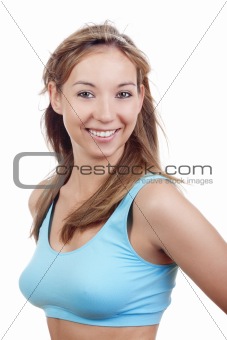 young woman in sports bra smiling - isolated on white