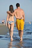 happy young couple have romantic time on beach