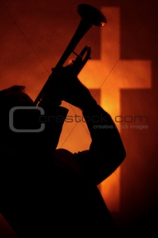 Trumpet In Silhouette Before Cross