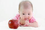 Baby girl with an apple
