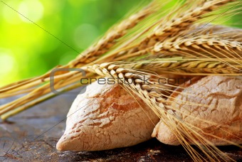 Portuguese bread and  spikes of wheat.
