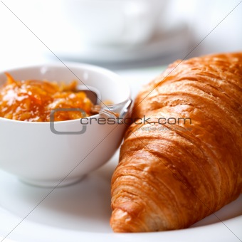 French croissant with orange jam