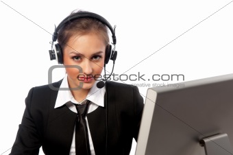 girl with a headset works at the computer