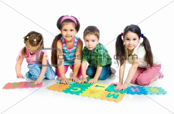 children are playing letters