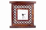 Clock in carved wood frame