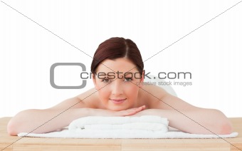Beautiful red-haired woman relaxing in a spa centre