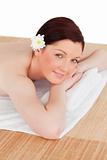 Portrait of a gorgeous serene woman posing while relaxing in a s
