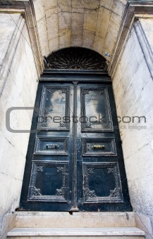 dark blue threadbare door