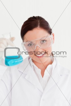 Cute scientist looking at the camera in a laboratory