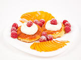 Pancakes with fruit in cream