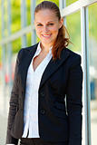 Portrait of smiling  business woman  at office building 
