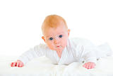 Cute  four month old  baby laying on abdomen on diaper
