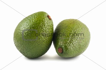 Two ripe green avocado