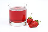 Glass with strawberry juice and berries