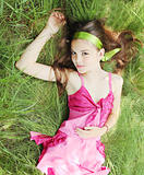 girl  lies on the grass