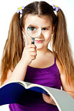 little girl with a magnifying glass