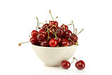Sweet red cherries in ceramic bowl