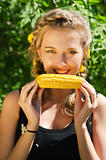 woman eating corn-cob