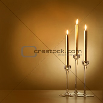 three gold candles