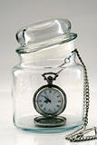 Old pocket watch in a glass jar – Time in a Bottle