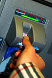 Insert a bank card or ATM card into the ATM machine