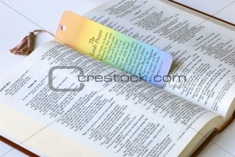 A colorful bookmark with the Holy Bible
