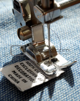 Putting the size label by a sewing machine